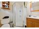 Bathroom featuring a shower, vanity with sink, and toilet at 2125 S Gilpin St, Denver, CO 80210