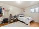 Bright bedroom with wood floors, a desk, and closet storage at 2125 S Gilpin St, Denver, CO 80210