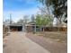 Exterior shot with a long driveway, landscaping and charming curb appeal at 2125 S Gilpin St, Denver, CO 80210
