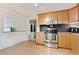 Well-equipped kitchen with stainless steel appliances, ample cabinetry, and stylish backsplash, creating a functional culinary space at 2125 S Gilpin St, Denver, CO 80210