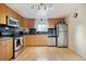 Well-equipped kitchen with stainless steel appliances, ample cabinetry, and stylish backsplash, creating a functional culinary space at 2125 S Gilpin St, Denver, CO 80210