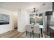 Bright dining area featuring a modern light fixture and a large window at 8035 W Eastman Pl # 106, Lakewood, CO 80227