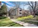 Multi-Gathering building featuring brick and siding, with manicured lawn and walkway at 8035 W Eastman Pl # 106, Lakewood, CO 80227