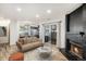 Inviting living room with a cozy fireplace and sliding glass doors to the outdoor patio at 8035 W Eastman Pl # 106, Lakewood, CO 80227