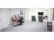 Large finished basement with an office and a seating area at 7100 Saulsbury St, Arvada, CO 80003