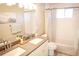 Bright bathroom with double sinks, and shower-tub combination at 7100 Saulsbury St, Arvada, CO 80003