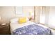 Comfortable bedroom with plush bedding and great natural light is perfect to unwind at 7100 Saulsbury St, Arvada, CO 80003