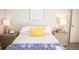 Well-lit bedroom with simple decor, side tables, and a bright, airy feel at 7100 Saulsbury St, Arvada, CO 80003