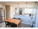 Inviting dining room and kitchen with modern appliances and hardwood floors, a perfect space at 7100 Saulsbury St, Arvada, CO 80003