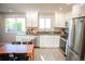 Stylish kitchen with stainless steel appliances, granite countertops, and lots of natural light at 7100 Saulsbury St, Arvada, CO 80003