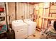 A functional laundry room with a washer, dryer, and plenty of room for storage and organization at 7100 Saulsbury St, Arvada, CO 80003
