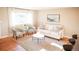 Cozy living room with natural light, comfortable seating, and modern décor creates a welcoming atmosphere at 7100 Saulsbury St, Arvada, CO 80003