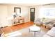 Inviting living room with stylish console, seating, and large window, perfect for relaxing or entertaining at 7100 Saulsbury St, Arvada, CO 80003