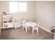 Adorable playroom with a play kitchen, a table, and a dollhouse at 7100 Saulsbury St, Arvada, CO 80003