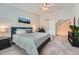 A comfortable bedroom featuring carpeting, stairs, and an open concept design at 9825 S Iris Ct, Littleton, CO 80127