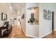 Inviting foyer featuring hardwood floors and an attractive plant niche at 9825 S Iris Ct, Littleton, CO 80127