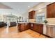 Modern kitchen featuring granite countertops, stainless steel appliances, and hardwood floors at 9825 S Iris Ct, Littleton, CO 80127