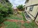 Backyard with mature trees, a swing set, and room to run around at 14190 E Gunnison Pl, Aurora, CO 80012