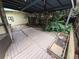 Outdoor deck perfect for relaxing and entertaining, with a partial roof and space for gardening at 14190 E Gunnison Pl, Aurora, CO 80012