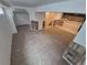 Finished basement featuring carpet, stone accents, stairs, and a full bathroom at 14190 E Gunnison Pl, Aurora, CO 80012