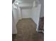 Basement room with neutral carpet, stone accents, and a window at 14190 E Gunnison Pl, Aurora, CO 80012