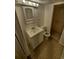 Bathroom features a vanity and shower with stylish tile work at 14190 E Gunnison Pl, Aurora, CO 80012