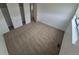 A carpeted bedroom with two closets and a window at 14190 E Gunnison Pl, Aurora, CO 80012