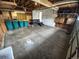 This spacious garage offers ample storage, featuring exposed beams and plenty of open space for vehicles and projects at 14190 E Gunnison Pl, Aurora, CO 80012