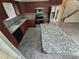 Open kitchen with stainless steel appliances, granite countertops and island with seating at 14190 E Gunnison Pl, Aurora, CO 80012
