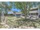 Spacious backyard features patio furniture, trampoline, and beautiful landscaping at 11218 Newark Ct, Commerce City, CO 80640