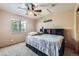 This bedroom features a large window, ceiling fan, and spacious design at 11218 Newark Ct, Commerce City, CO 80640