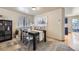 Dining area with a modern table setting and stylish decor, adjacent to the kitchen and perfect for entertaining at 11218 Newark Ct, Commerce City, CO 80640