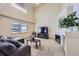 Cozy living room featuring a fireplace and vaulted ceilings at 11218 Newark Ct, Commerce City, CO 80640