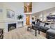 Open-concept living room with fireplace and view of the second floor at 11218 Newark Ct, Commerce City, CO 80640