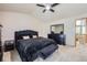 Spacious main bedroom with large windows and contemporary furnishings at 11218 Newark Ct, Commerce City, CO 80640