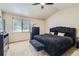 Comfortable main bedroom featuring a high ceiling and ample natural light at 11218 Newark Ct, Commerce City, CO 80640