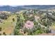 Aerial view shows this beautiful home situated on a hillside with scenic views at 28 Indian Paintbrush Dr, Golden, CO 80401