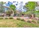Expansive backyard featuring a patio, lawn, and landscaping, ideal for outdoor enjoyment at 28 Indian Paintbrush Dr, Golden, CO 80401