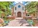 Beautiful home exterior with stone accents, arched entryway and stunning double front door at 28 Indian Paintbrush Dr, Golden, CO 80401