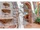 Elegant fountain with detailed stonework and statue feature in a sunroom at 28 Indian Paintbrush Dr, Golden, CO 80401