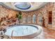 Indoor pool featuring stone accents, recessed lighting, and large windows for natural light at 28 Indian Paintbrush Dr, Golden, CO 80401