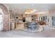 Well-equipped kitchen boasts stone countertops, modern appliances, and a charming breakfast nook at 28 Indian Paintbrush Dr, Golden, CO 80401