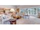 Bright and spacious living room with large windows, plush furniture, and elegant decor at 28 Indian Paintbrush Dr, Golden, CO 80401
