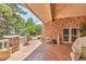 Covered patio with stone accents and wrought-iron details, perfect for outdoor lounging at 28 Indian Paintbrush Dr, Golden, CO 80401