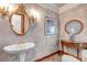 Elegant powder room with decorative mirror, stylish sink, and classic design at 28 Indian Paintbrush Dr, Golden, CO 80401