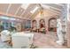 Bright sunroom with skylights, brick accents, tile floors and plenty of seating at 28 Indian Paintbrush Dr, Golden, CO 80401