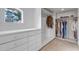 Well-organized walk-in closet featuring built-in shelving, drawers, and natural light at 28 Indian Paintbrush Dr, Golden, CO 80401