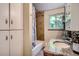 Updated bathroom with a granite vanity top and tiled shower and tub at 4365 Kendall St, Wheat Ridge, CO 80033