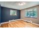 Bright bedroom with hardwood floors, featuring large windows that allow ample natural light at 4365 Kendall St, Wheat Ridge, CO 80033