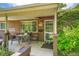 Inviting covered front porch with seating area, showcasing the home's address and a welcoming entrance at 4365 Kendall St, Wheat Ridge, CO 80033